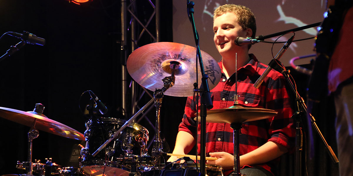 Young man at drum kit
